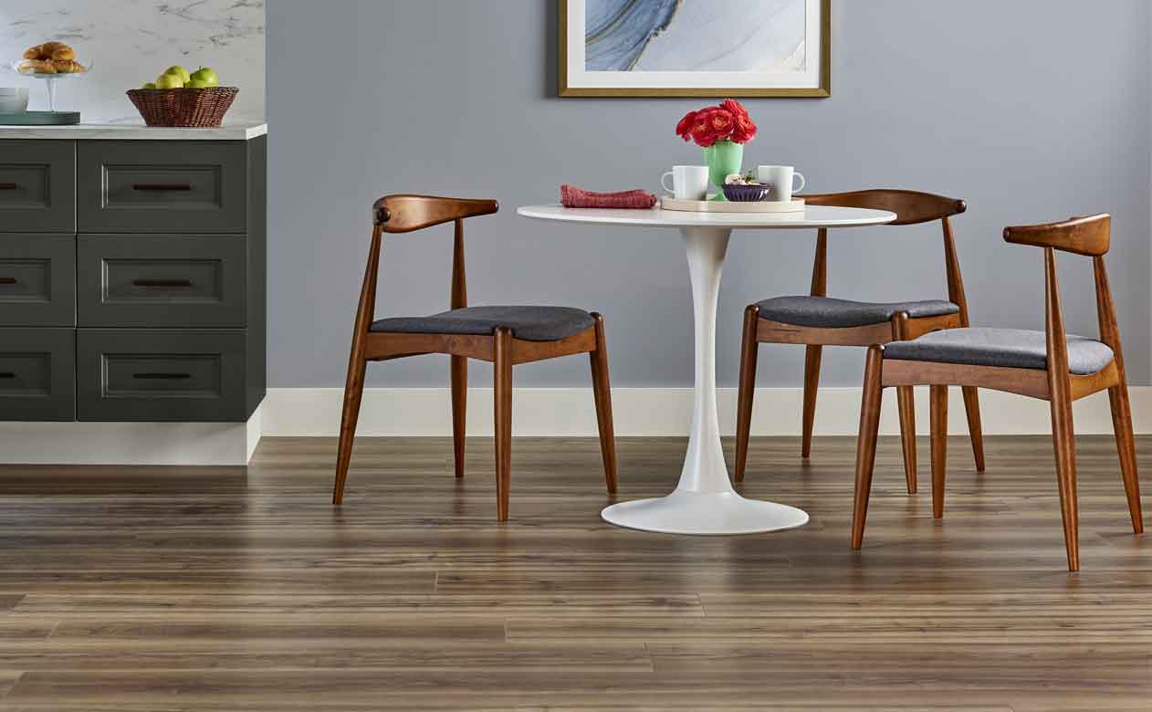 luxury vinyl in modern kitchen with white table and wood chairs